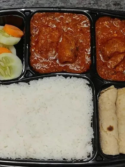Enjoy a hearty and satisfying meal with our non-vegetarian thali. This combo features rich chicken curry, long-grain rice, soft rotis, and a crisp salad, offering a complete and balanced dining experience.