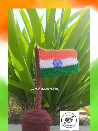 The crochet Tiranga shown in a lovely outdoor setting. This forever flag is washable and a wonderful, long-lasting gift for Independence Day or Republic Day.
