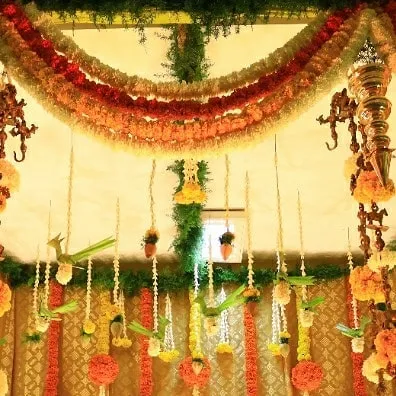 The richness of traditional Indian decor is something we deeply appreciate. Here, we used vibrant marigold garlands and classic brass elements to create a warm and festive atmosphere for an intimate home celebration.