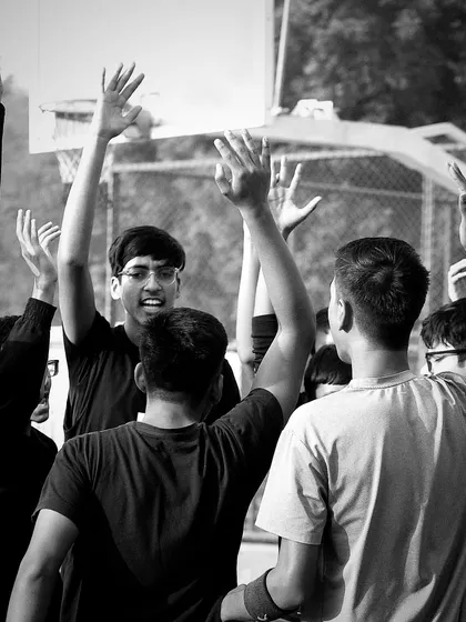 The fierce war cry of our team ignites their spirit with an unstoppable force. This is the strength in unity that we build at our academy. Victory awaits those who dare to fight.