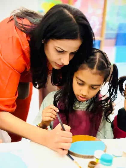 Me guiding a group of young, curious artists. It's so important to create a supportive environment where children feel free to ask questions and experiment.
