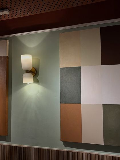 A view of the Kanpur cafe wall, showing how the different abstract pieces work together.