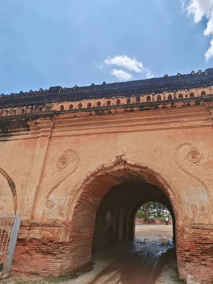 Riding through the arched gateway of the Devanahalli fort. It feels like entering another era.