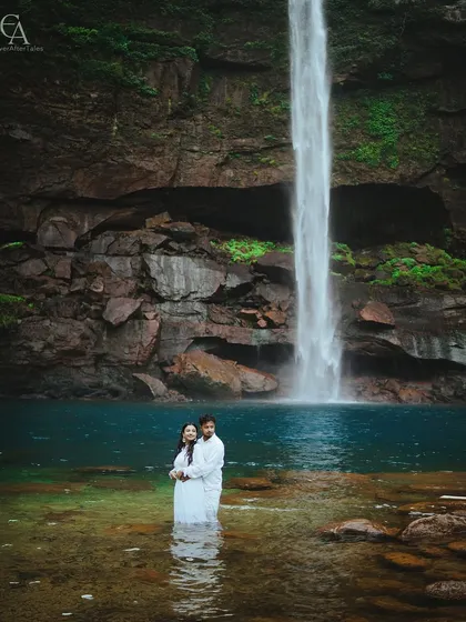 Standing together in the cool, clear water at the base of the falls. This intimate portrait is about being present in the moment, feeling the power of nature and the strength of your bond.
