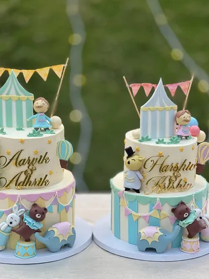 The cutest first birthday party for two sets of twins! I created two matching circus-themed tiered cakes with pastel colors and adorable fondant animals. It was one of the most extravagant party setups I've ever seen.