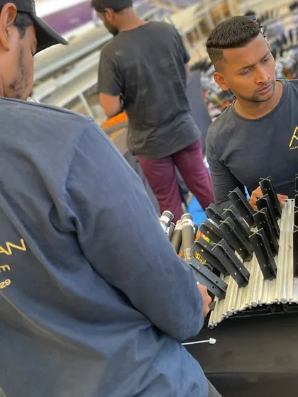 The crew at work, wearing their custom T-shirts, showcasing the practical application of our merchandise services.