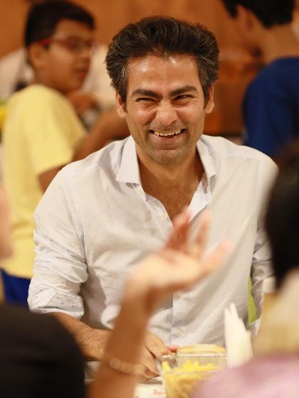 Mohammad Kaif shares a laugh at the party. We strive to create a relaxed and enjoyable atmosphere for all our guests, including the parents.