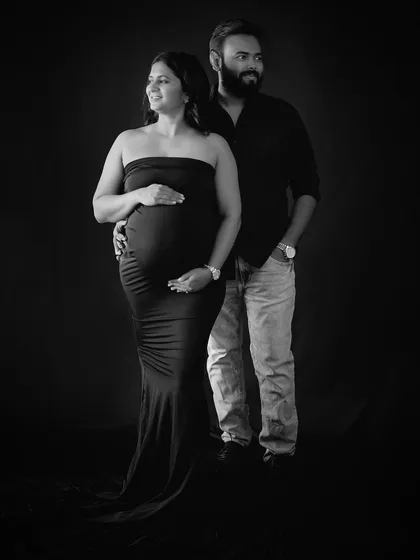 A timeless black and white portrait that focuses purely on the bond between you and your partner. This classic studio style creates elegant, lasting memories.