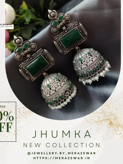 This emerald green version of the oxidized jhumka is a crowd favorite. The rich green stone set against the silver-toned metal creates a classic and elegant combination.