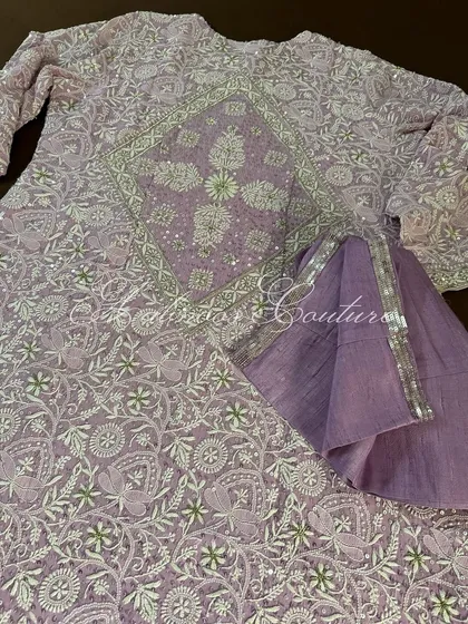 The back of our lilac Anarkali, featuring a stunning diamond-shaped jaal pattern, ensuring elegance from every angle.