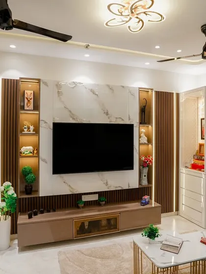 A full view of the entertainment wall, featuring a marble-finish panel, wooden fluting, and integrated display shelves.