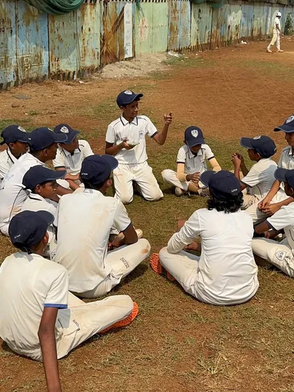 Cricket is a team game, and leadership starts early. Here you can see one of my young players leading a team talk during a U-14 match at Azad Maidan. I empower them to take ownership of the game.