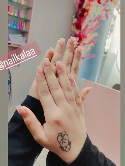 A clean and simple set of short, clear nail extensions, perfectly shaped and ready for any design or to be worn as is.