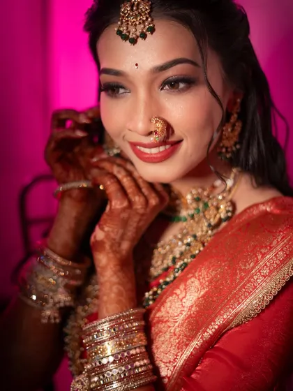 An artistic portrait of a traditional Maharashtrian bride. I see bridal photography as an art form, focusing on the emotion in her eyes, the heritage in her nath, and the story behind her smile.