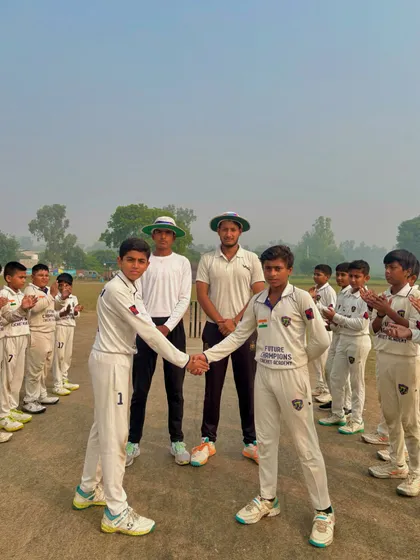 The captains shake hands at the toss, surrounded by their teams.