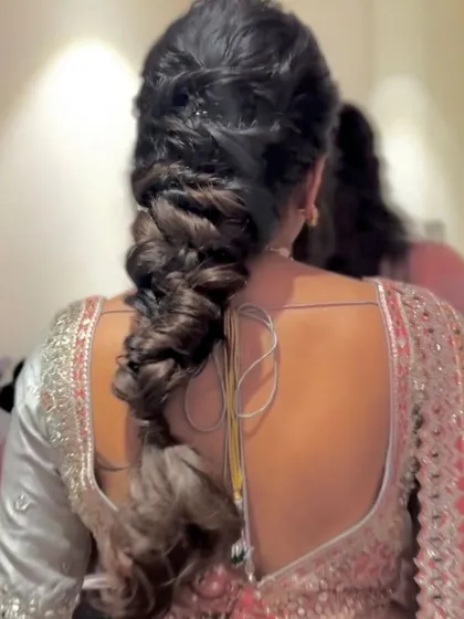 A beautiful and intricate fishtail braid. This style is perfect for a bride who wants a detailed and elegant look.