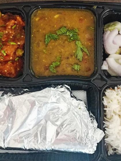 A classic thali of dal and baingan bharta. The smoky flavor of the roasted eggplant is a favorite among many of my customers.