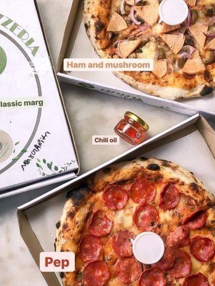 A perfect delivery order featuring a Ham and Mushroom pizza and a Pepperoni pizza. I also include my homemade chili oil for those who like an extra kick.