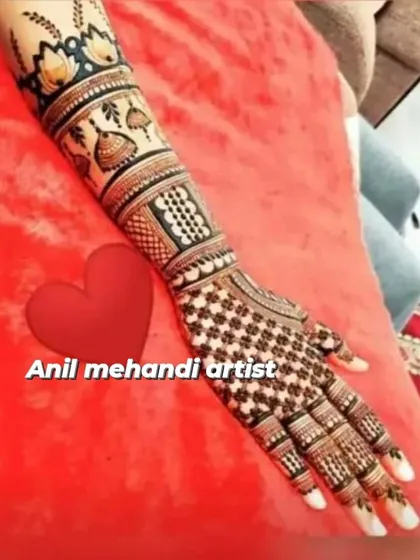 This design features hanging 'jhumka' motifs and lotus flowers on the arm, with a dense grid pattern covering the entire hand.