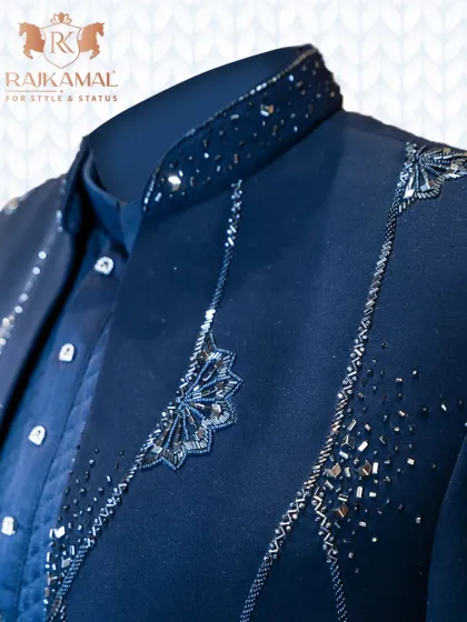 Another close-up of the navy blue open Indo-Western set, focusing on the modern flair and the interplay of textures between the jacket and the cowl kurta.
