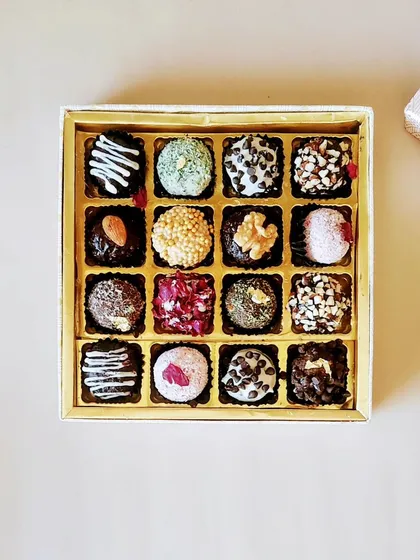 An overhead view of our 16 piece crunchy chocolate truffle box. This assortment is a popular choice for Diwali and corporate gifting, offering a variety of flavors in one beautiful package.