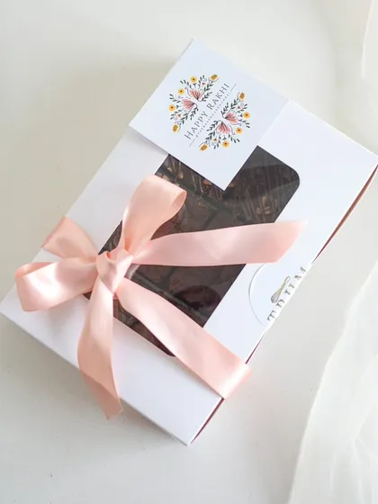 My assorted brownie box tied with a delicate pink ribbon, ready for Rakhi gifting.