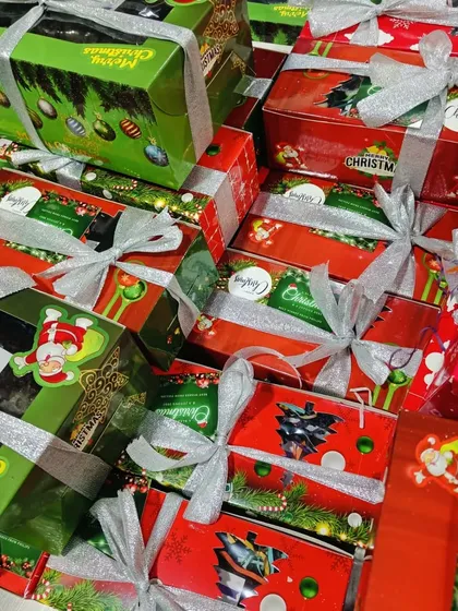 The season of giving. My Christmas goodies are packed into these festive gift boxes, tied with a silver ribbon, and ready to be shared with friends, family, and colleagues.