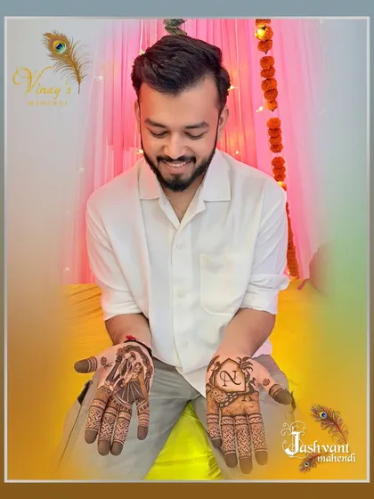 A clear, front-facing view of the groom's personalized mehndi designs.