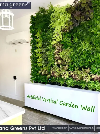 An artificial vertical garden wall installed in a bright, modern interior. It provides a beautiful green backdrop that complements the clean lines of the space.