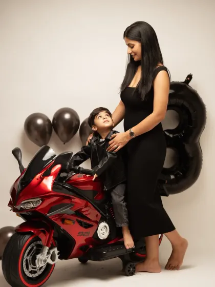 A sweet moment between mother and son during his third birthday photoshoot. We always encourage parents to jump in for a few shots to capture the family connection.