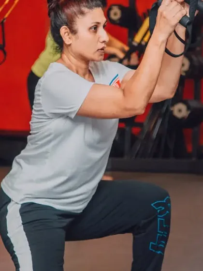 We use versatile equipment like the TRX for functional strength. This client is performing a TRX lunge, an excellent exercise for building single leg strength, stability, and balance.