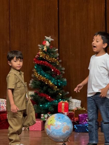 A close-up of our young actors, fully immersed in their roles during a performance.