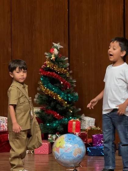 A close-up of our young actors, fully immersed in their roles during a performance.