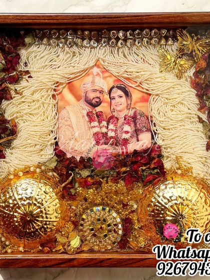 A full view of the sehra, kaleera, and varmala preservation frame. It’s a complete narrative of the wedding attire, captured forever in a dark wood frame.