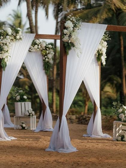 Beachside weddings at their best. This elegant white-draped mandap setup at Varcale Palms, Goa, is the perfect example of a dreamy, romantic beach ceremony.