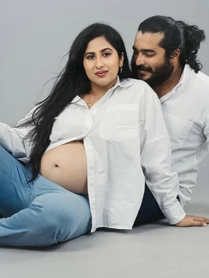 A quiet moment of connection between partners during a studio maternity photoshoot. My goal is to create a relaxed atmosphere where you can feel comfortable, resulting in timeless images that celebrate this special time.