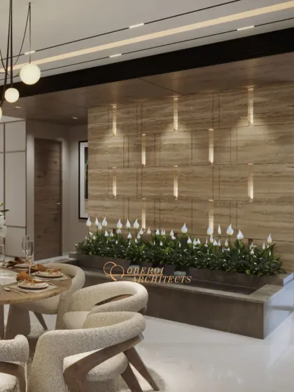 A unique feature wall with an integrated planter and cascading lights adds a touch of nature and artistry to the dining space.