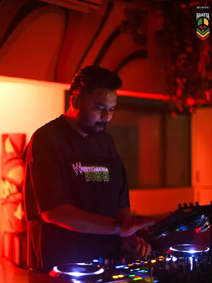 Under the red lights at Raasta, deep in the mix. The lighting and atmosphere of a club are crucial for setting the right mood.