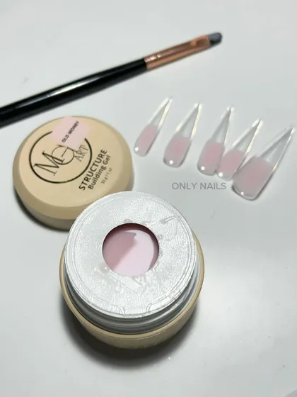 Technique is everything. This shot shows the difference between older brush application methods and my current use of dual forms with structure gel for creating extensions with consistent strength and clean architecture.