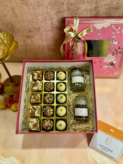 The 'Bliss Box' is a perfect example of our commitment to pure ingredients, featuring sweets made with desi ghee, khand, and homemade mawa.