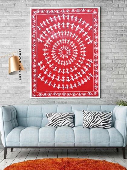 This mockup shows the same Warli artwork in a different setting, against a brick wall, demonstrating its versatility in various interior design styles.