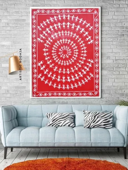 This mockup shows the same Warli artwork in a different setting, against a brick wall, demonstrating its versatility in various interior design styles.