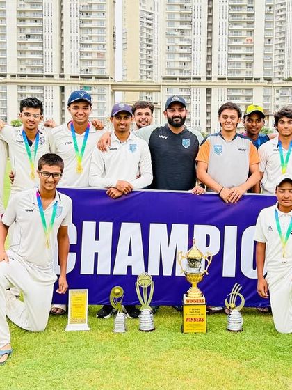 The full U-19 squad with their medals and trophies after a successful tournament campaign.