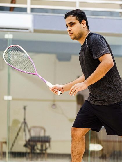 Capturing the follow-through of a powerful swing from Yash Salunkhe. This image freezes the motion, showing the technique and athleticism involved in every shot.