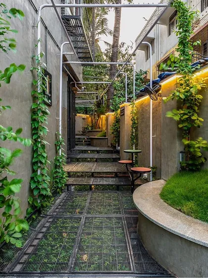 Even the narrowest urban plots can become a green escape. In this Mumbai project, I used vertical climbers and a carefully planned layout to transform a tight alleyway into a lush, functional courtyard space.