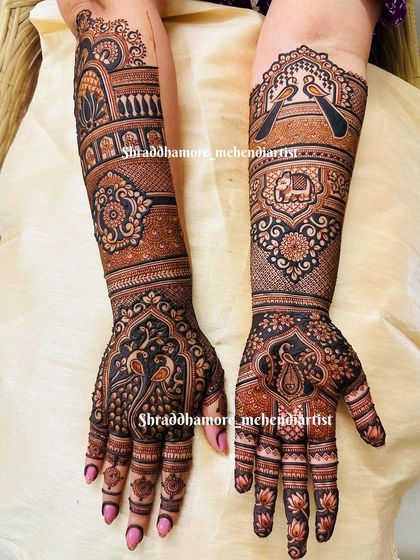 A classic design featuring peacocks, elephants, and love birds. The use of negative space around the central motifs makes them the focal point.