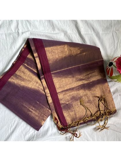 A unique purple and gold tissue cotton saree. This color would pair beautifully with silver or gold jewelry.