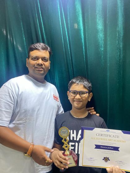 Shaurya receives his prize for completing the 1st level of Abacus. Keep up the excellent work!