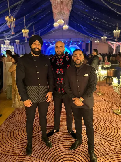 Posing with the crew at a massive wedding in Delhi, India. The scale of this event was incredible, with stunning decor and a huge guest list.