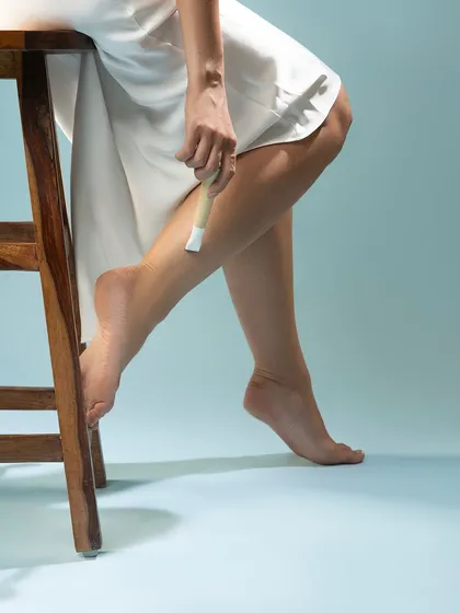 A close-up on the legs, showing the product in use. This type of shot focuses on the results and the experience of using the product.